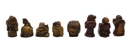 null JAPAN - 20th century
Eight small okimono in the netsuke style, three in wood...