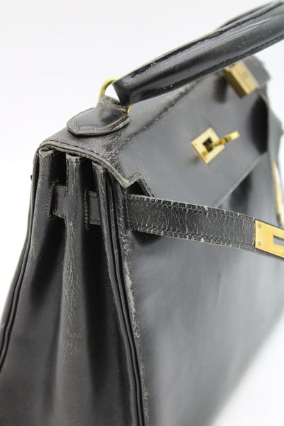null HERMES, Kelly model handbag in black leather, one handle, with padlock, accompanied...