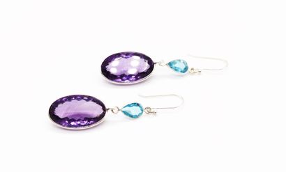 null *Pair of earrings in 925 sterling silver set with oval-cut amethysts, each topped...