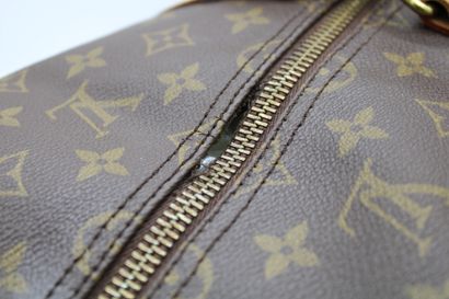 null Louis VUITTON, Keepall model travel bag in leather and canvas monogrammed LV,...