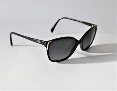 null PRADA, Pair of sunglasses, black plastic with gold metal trim, with case