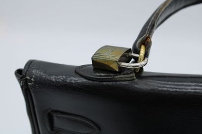 null HERMES, Handbag model Kelly in black leather, one handle, one padlock, accompanied...