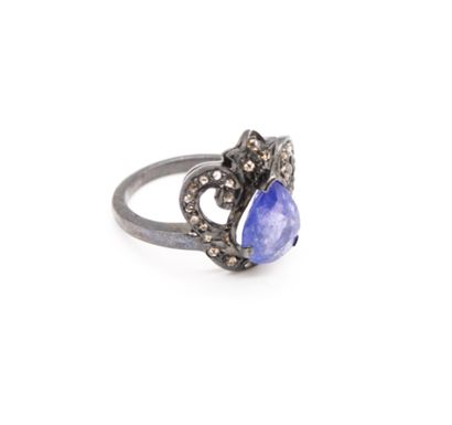 null *925 blackened silver ring set with a pear-cut tanzanite highlighted with small...