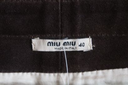 null MIU MIU, Short skirt in distressed brown leather with silk and lace, closes...
