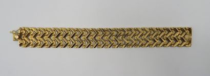 null Ribbon bracelet in 18K foreign yellow gold, with zigzag pattern interspersed...