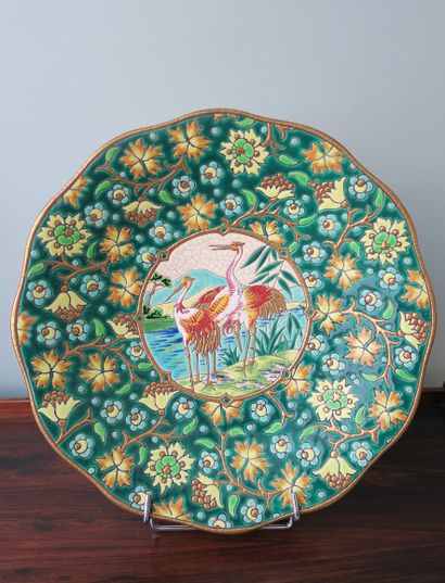 null LONGWY
Large dish on a pedestal in polychrome enamels, decorated with flowers,...