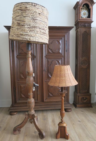 null Two turned-wood floor lamps, one in oak, the other in fruitwood.
The larger...