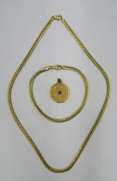 null Necklace and bracelet in 18K yellow gold, with a round gold pendant. 
PB. 16,1...