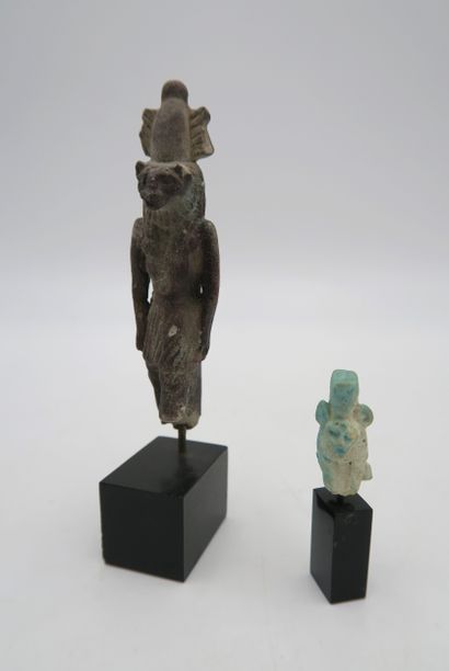 null Set of two amulets including a rare statuette of the god Mahes wearing the Atef...