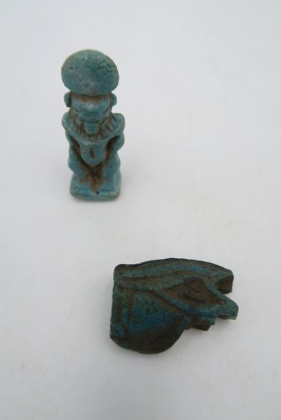 null Set of two amulets including a standing figure and a seated Horus
Frit
3.2 to...