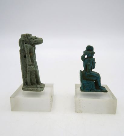null Set of two amulets including a standing figure and a seated Horus
Frit
3.2 to...