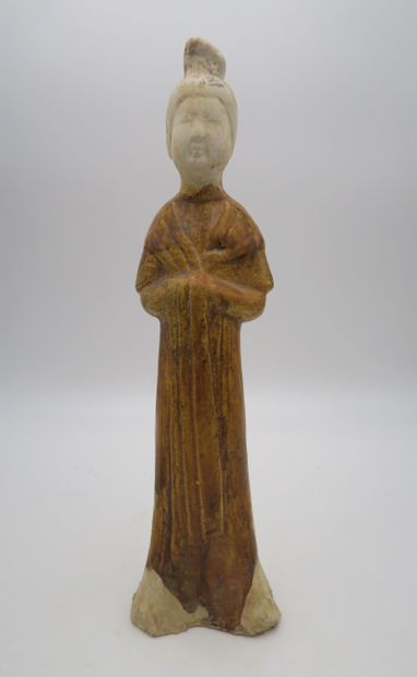 null Court lady in brown glazed terra cotta
China, Tang dynasty (618-907)
Shown standing,...