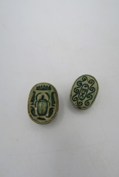null Set of two scarab beads engraved on the reverse, one with a scarab and the other...