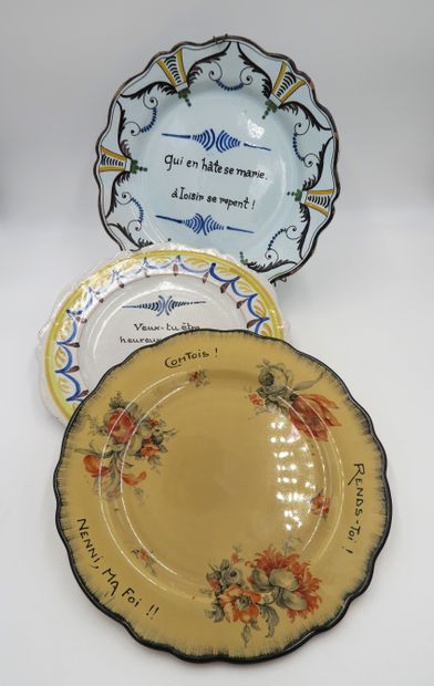 null Set of three earthenware plates with inscriptions: one with a yellow background...