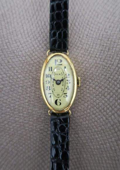 null ELK
Ladies' wristwatch with oval case in 18K yellow gold, gold dial with black...