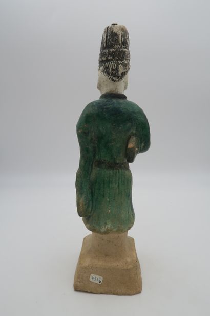 null Three statuettes of guardians in green and brown enameled stoneware
Depicted...