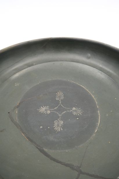 null Large Kylix in black lustre ceramic with two handles and central decoration...