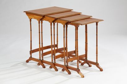 null Suite of four nesting tables in veneer with diamond inlays and framing friezes...