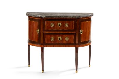 null A half-moon shaped chest of drawers in violet and amaranth wood, opening to...