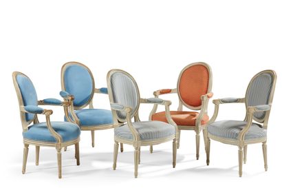 null Five moulded and painted beechwood armchairs with cabriolet medallion backs,...