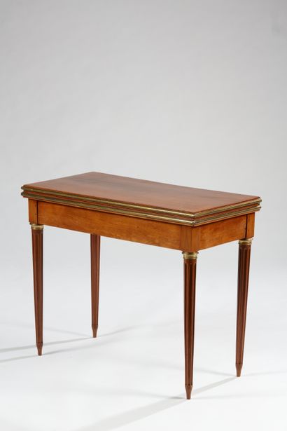 null Mahogany shutter table, the folding top resting on tapered legs with flutes;...