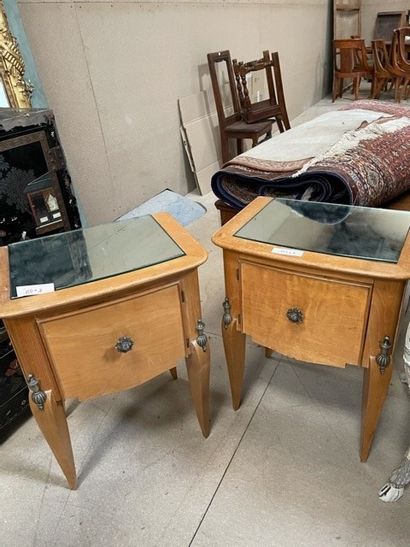 null Two veneered wood bedside tables in the 1940's style,

A carved wood table with...