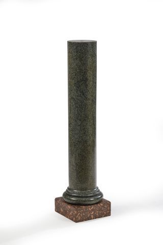 null A truncated green marble column resting on a cylindrical base and a quadrangular...