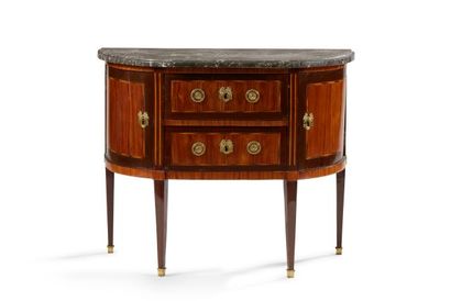 null A half-moon shaped chest of drawers in violet and amaranth wood, opening with...