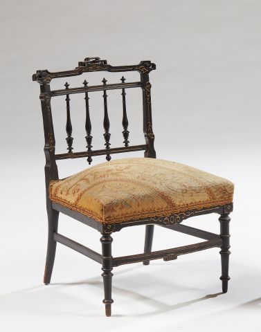 null Blackened wood armchair, stylized bar back 

Napoleon III period 

67 x 45 x...