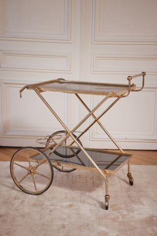 Gilt brass trolley with two smoked glass...