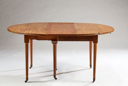 null Mahogany and mahogany veneer shutter table on six legs with casters 

19th century...