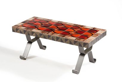 null Rectangular coffee table with metal legs and a top covered with red and brown...