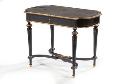 null A blackened wood, gilt bronze and brass inlaid middle table, the rectangular...