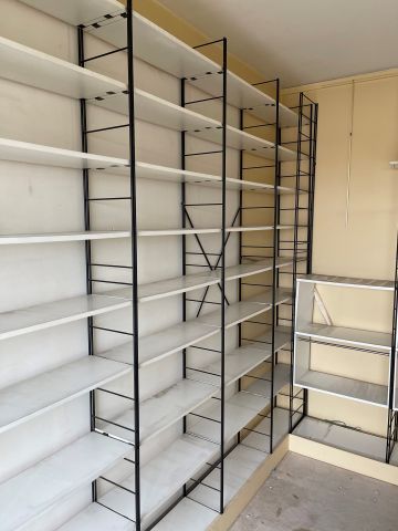 null 
Important lot of String style shelving, black lacquered metal frames, white...