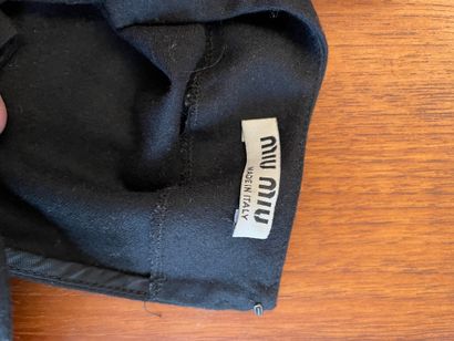 null MIU MIU 

Set including navy blue satin jacket and black wool ruffle top.

For...