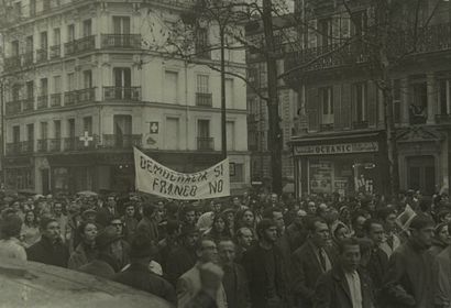 null Unidentified photographer. Nine (9) photographs of demonstrations in Paris including...