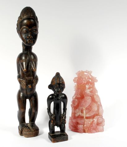 null Set including : 



Male figure in blackened wood represented standing with...