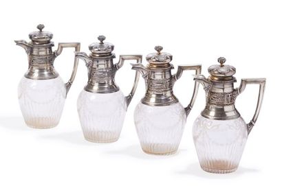 null Suite of four carafes in cut crystal, the mounts in silver 925/000 with decoration...
