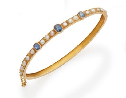 null Bracelet in yellow gold 18K 750/000 decorated with a half row of cloisonne pearls...