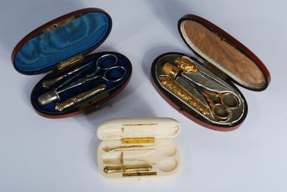Set including: gilt metal sewing kit in an...