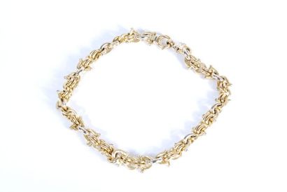 null Necklace in white and yellow gold 18K 750/000 decorated with articulated links...