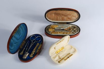 null Set including: gilt metal sewing kit in an oval case, sewing kit in an oval...