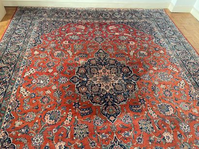 null Large laina carpet decorated with a central blue medallion on a red background...