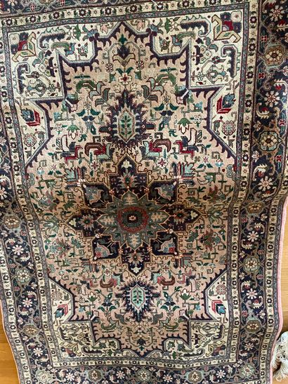 null TABRIZ 

Wool and silk carpet decorated with rosettes and stylized flowers on...