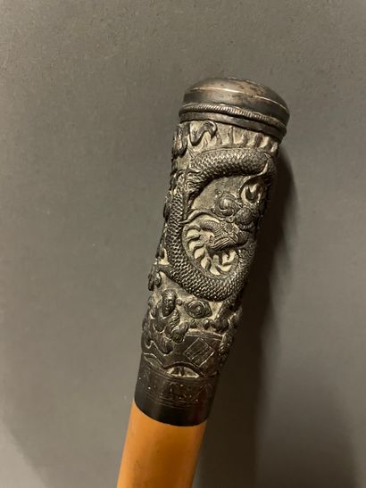 null China, 19th century 

Silver cane knob with relief decoration of dragons and...