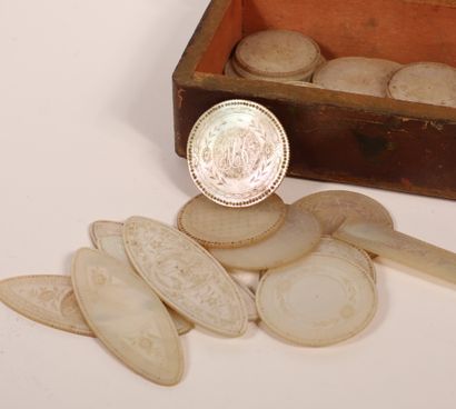 null Set of thirty-five engraved mother-of-pearl tokens, some figured, in six different...