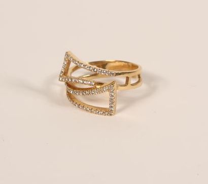 null Ring in 18K yellow gold 750‰, crossed and openwork, set with brilliant-cut diamonds.
Finger...