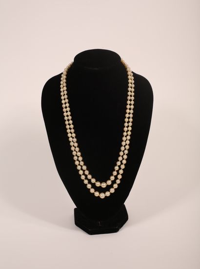 null Necklace featuring two strands of drop cultured pearls mounted on wire, oval-shaped...