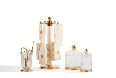 null GUERLAIN, Paris 
Toilet service consisting of two covered jars and a glass with...