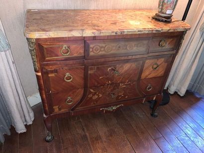 null Veneer chest of drawers opening with three drawers on the front.
The front with...